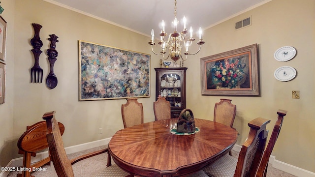 dining room featuring baseboards, a chandelier, visible vents, and crown molding