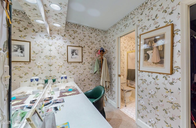 office area with baseboards, light tile patterned flooring, a sink, and wallpapered walls