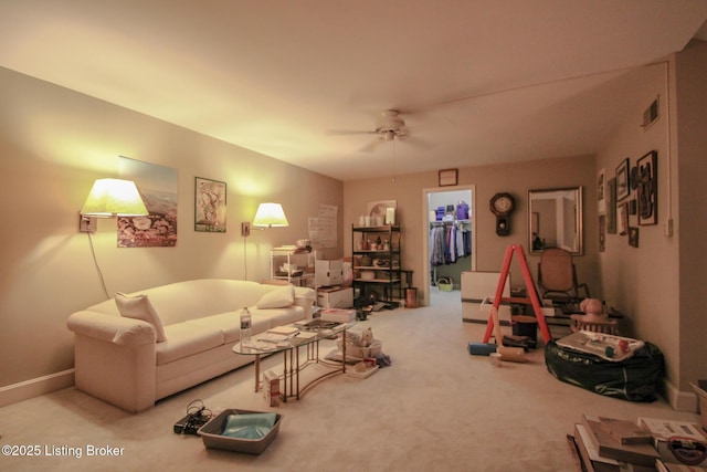 living room featuring carpet flooring, ceiling fan, and baseboards