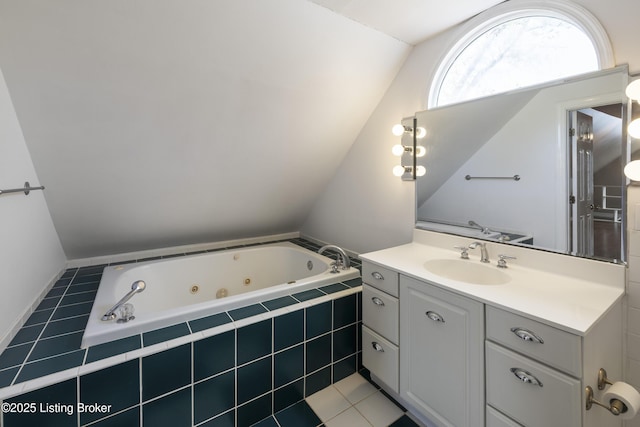 full bathroom with lofted ceiling, a jetted tub, and vanity