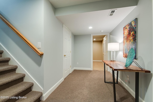 hallway featuring recessed lighting, visible vents, stairway, carpet flooring, and baseboards