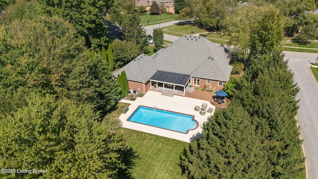 outdoor pool featuring a patio