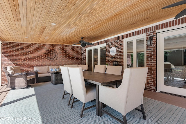 wooden deck featuring outdoor dining area, ceiling fan, and an outdoor hangout area