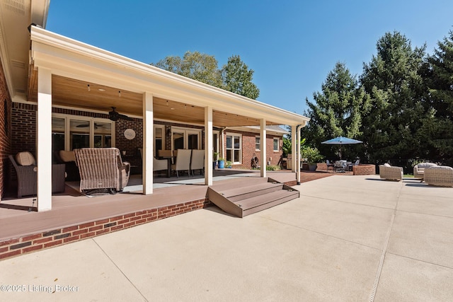 view of patio / terrace featuring a ceiling fan, outdoor dining space, and an outdoor hangout area