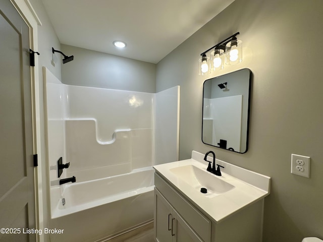 bathroom featuring vanity and shower / tub combination