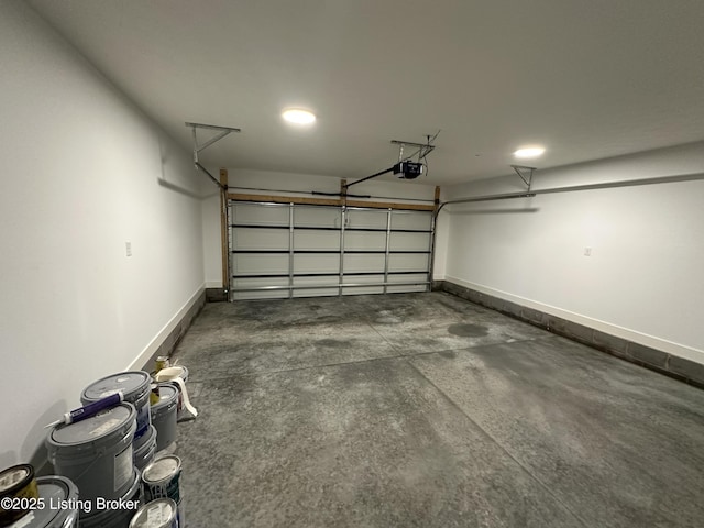 garage featuring baseboards and a garage door opener