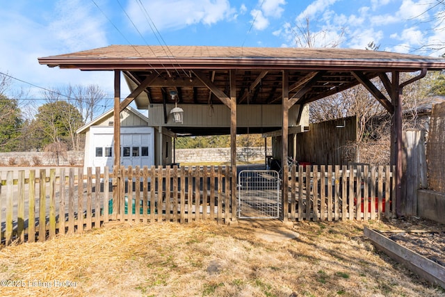 view of yard featuring an outbuilding and fence