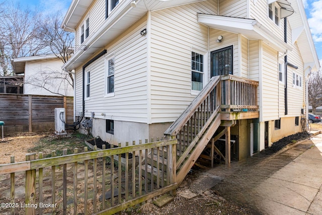 view of property exterior featuring fence