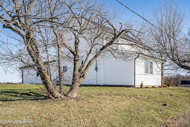 view of property exterior with a yard