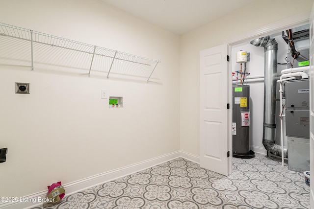 laundry area featuring water heater, laundry area, baseboards, and hookup for an electric dryer