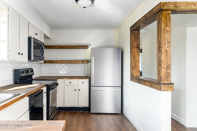 kitchen featuring stainless steel appliances, tasteful backsplash, open shelves, and white cabinetry