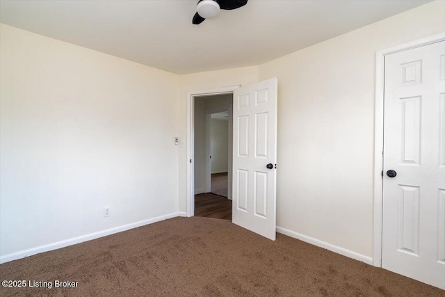 unfurnished bedroom featuring carpet flooring and baseboards