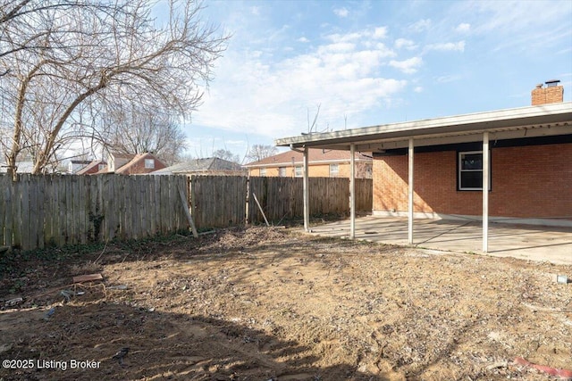 view of yard with a patio area and a fenced backyard