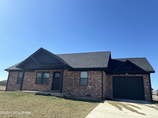 view of front of house with a shingled roof, concrete driveway, an attached garage, a front lawn, and brick siding