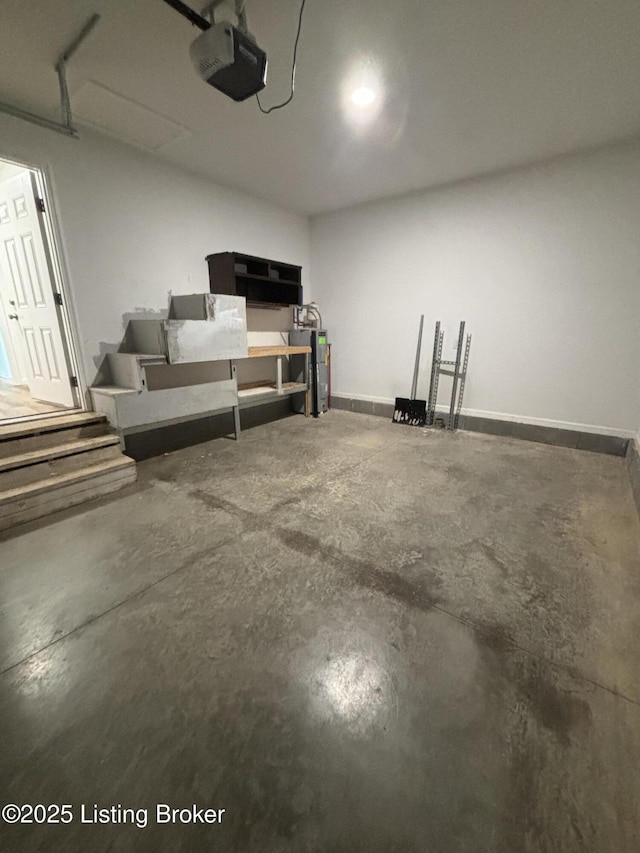 garage featuring baseboards and a garage door opener