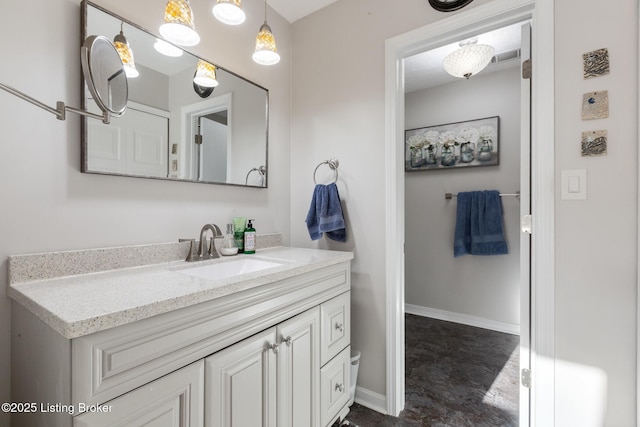 bathroom with vanity and baseboards