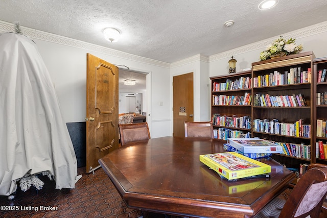 home office with ornamental molding and a textured ceiling