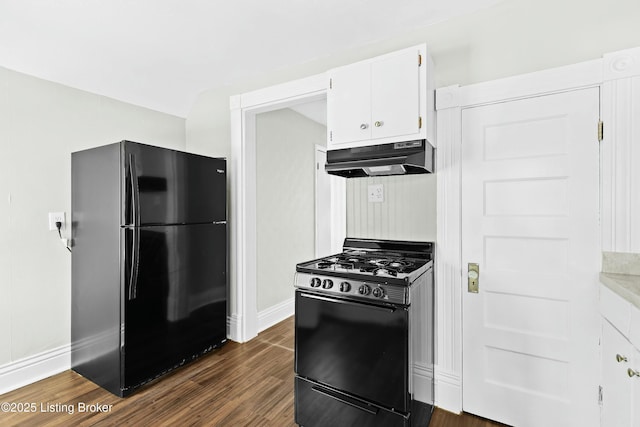 kitchen with white cabinets, dark wood finished floors, under cabinet range hood, light countertops, and black appliances