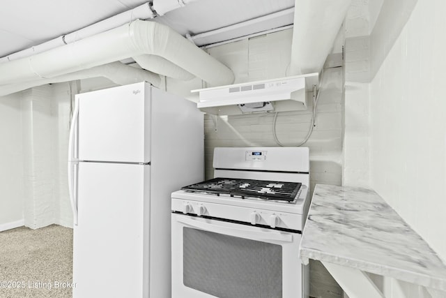 kitchen featuring white appliances and under cabinet range hood