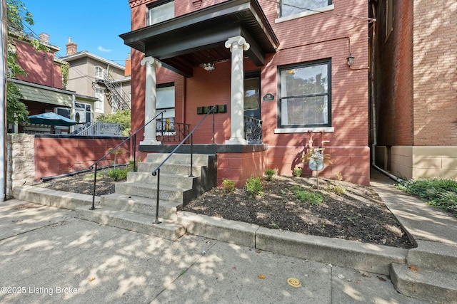 property entrance with brick siding