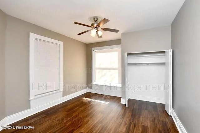 unfurnished bedroom with a ceiling fan, baseboards, and wood finished floors