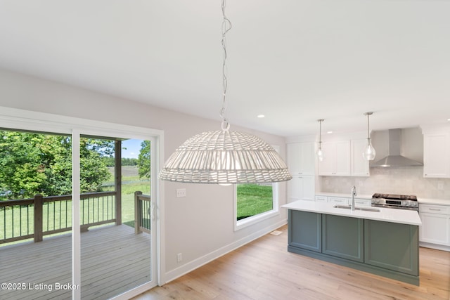 3314 Catalpa Farms Dr, Fisherville, KY 40023 - kitchen featuring wall chimney range hood, stainless steel stove, light countertops, decorative backsplash, and recessed lighting