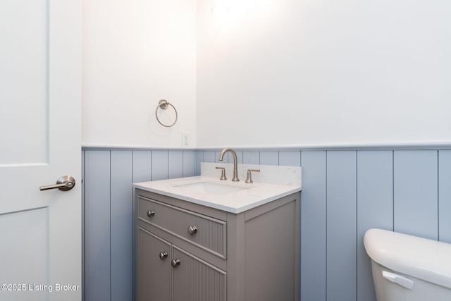 3314 Catalpa Farms Dr, Fisherville, KY 40023 - half bath featuring toilet, vanity, wainscoting, and a decorative wall