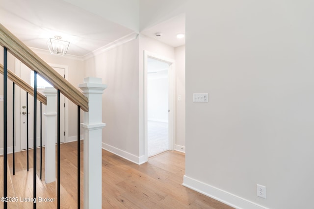 3314 Catalpa Farms Dr, Fisherville, KY 40023 - hallway with baseboards, light wood-style floors, crown molding, and a chandelier