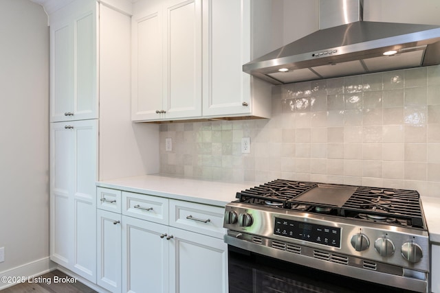 3314 Catalpa Farms Dr, Fisherville, KY 40023 - kitchen with wall chimney range hood, stainless steel range with gas stovetop, light countertops, white cabinetry, and decorative backsplash