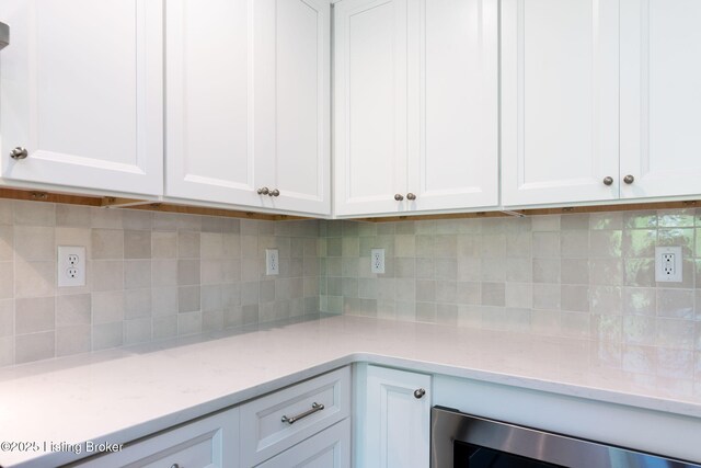 3314 Catalpa Farms Dr, Fisherville, KY 40023 - kitchen featuring white cabinets, tasteful backsplash, and light stone countertops
