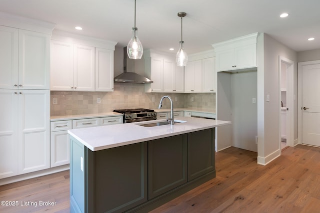 3314 Catalpa Farms Dr, Fisherville, KY 40023 - kitchen with wall chimney range hood, stainless steel gas range oven, a sink, white cabinetry, and recessed lighting