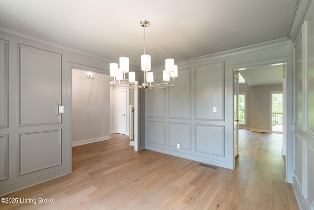 3314 Catalpa Farms Dr, Fisherville, KY 40023 - unfurnished dining area featuring a decorative wall, a chandelier, light wood finished floors, and ornamental molding