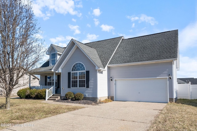 view of front of property featuring covered porch, a garage, a shingled roof, concrete driveway, and a front lawn