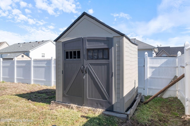 view of shed featuring a fenced backyard