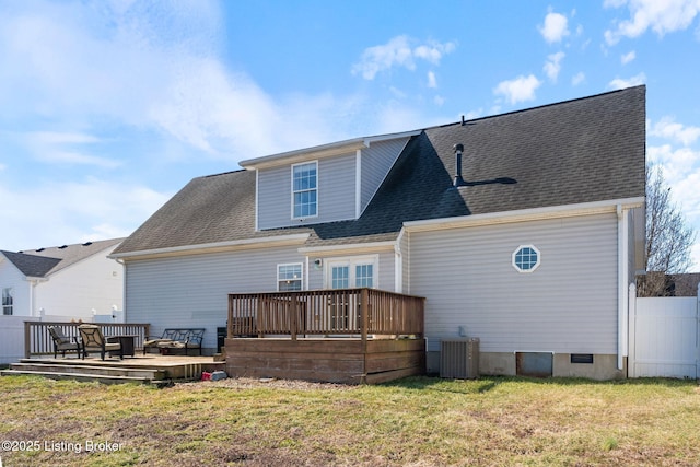 rear view of house featuring a yard, a deck, and central air condition unit