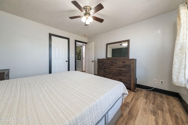 bedroom with ceiling fan and wood finished floors