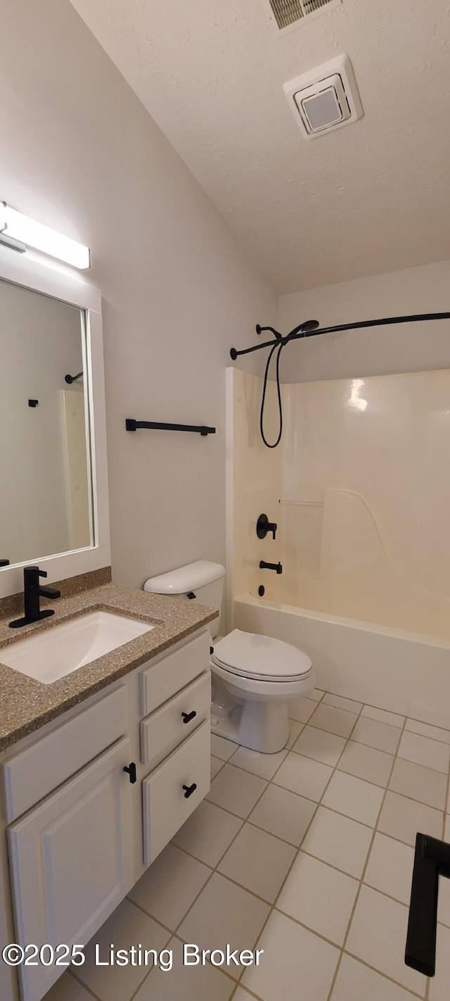 full bathroom featuring bathtub / shower combination, toilet, visible vents, vanity, and tile patterned floors