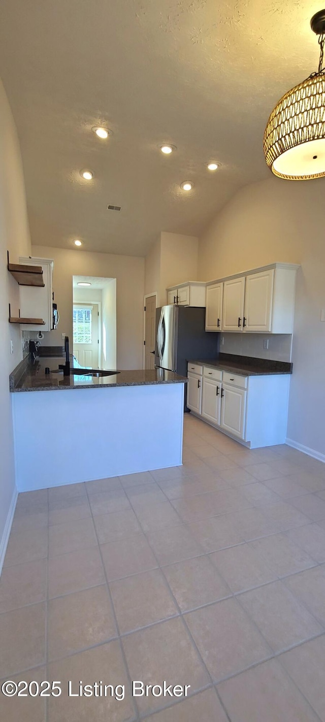 kitchen featuring white cabinets, lofted ceiling, a peninsula, open shelves, and recessed lighting