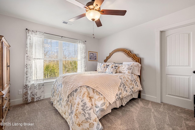 bedroom featuring ceiling fan, carpet flooring, visible vents, and baseboards