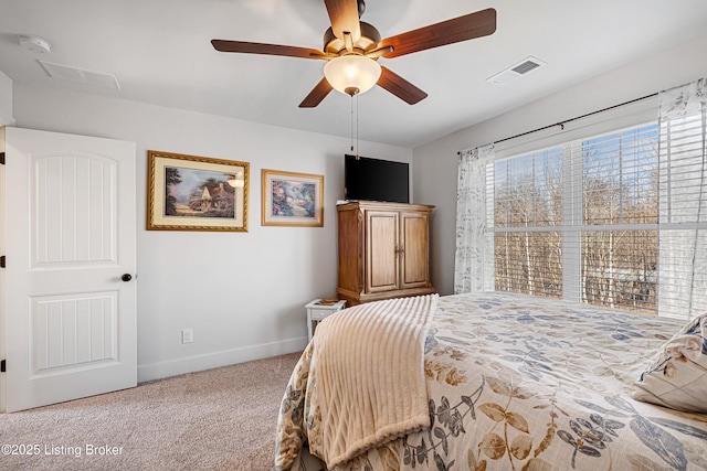 bedroom with ceiling fan, carpet floors, visible vents, and baseboards