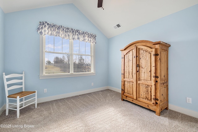 unfurnished bedroom featuring vaulted ceiling, carpet flooring, visible vents, and baseboards