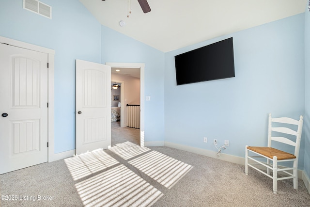 unfurnished bedroom with baseboards, visible vents, ceiling fan, carpet flooring, and high vaulted ceiling