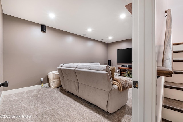 carpeted cinema room with recessed lighting and baseboards