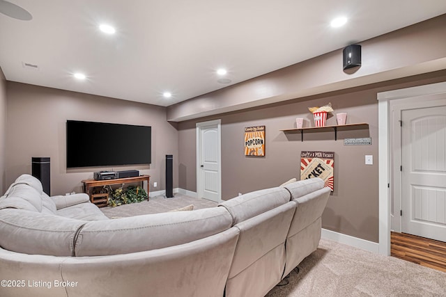 living area featuring light carpet, baseboards, visible vents, and recessed lighting