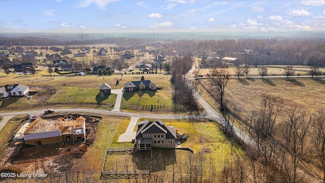 birds eye view of property with a rural view