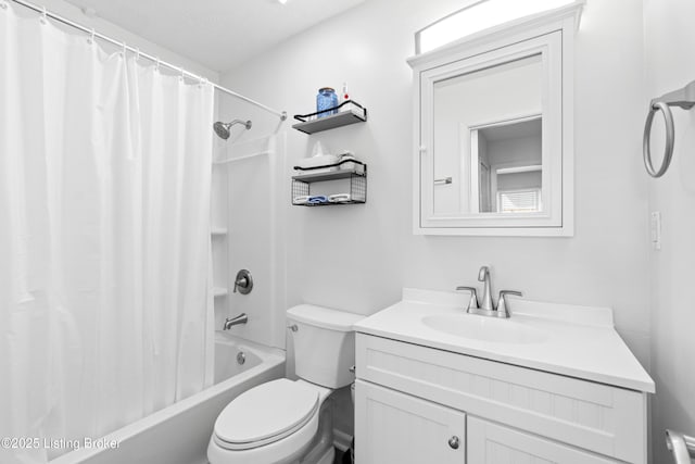 bathroom with vanity, shower / tub combo, and toilet