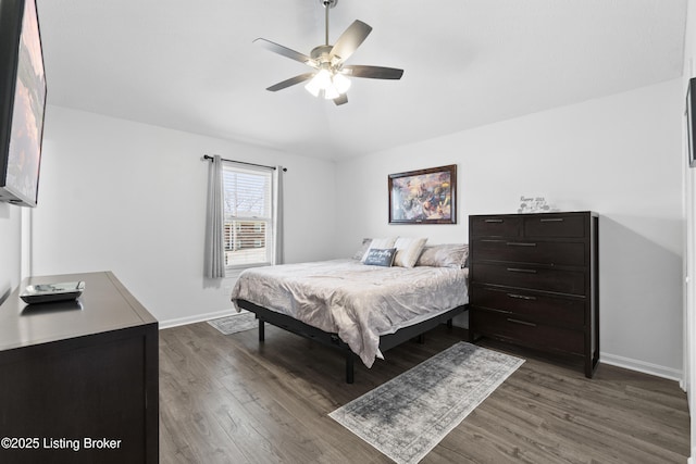 bedroom with baseboards, dark wood finished floors, and a ceiling fan