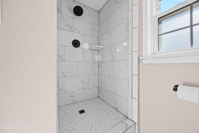 full bathroom with tiled shower