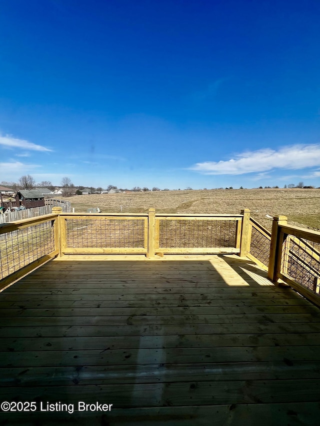 wooden terrace with a rural view