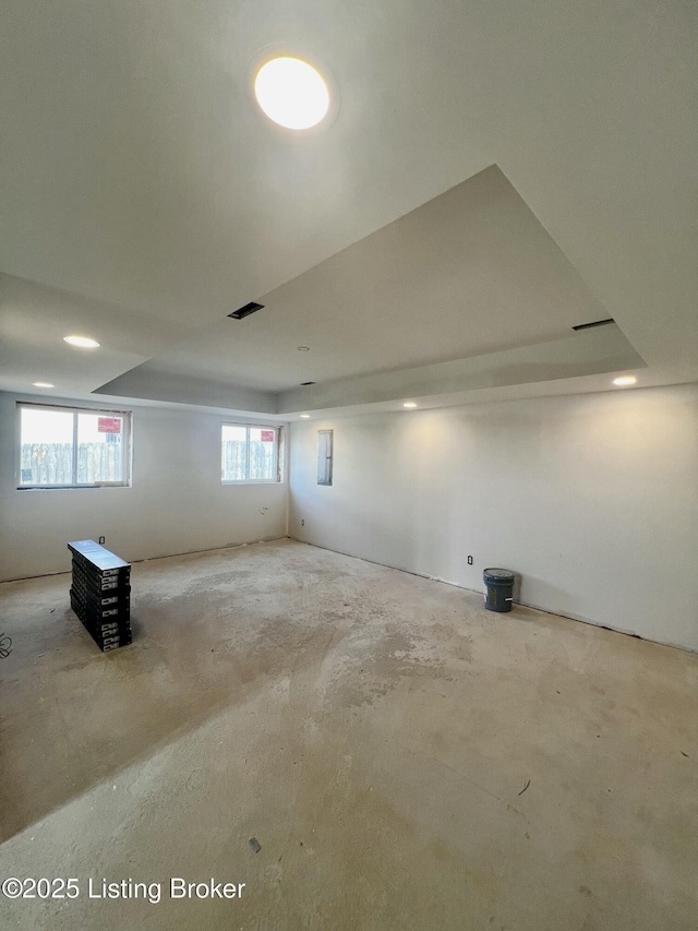 basement featuring electric panel and visible vents